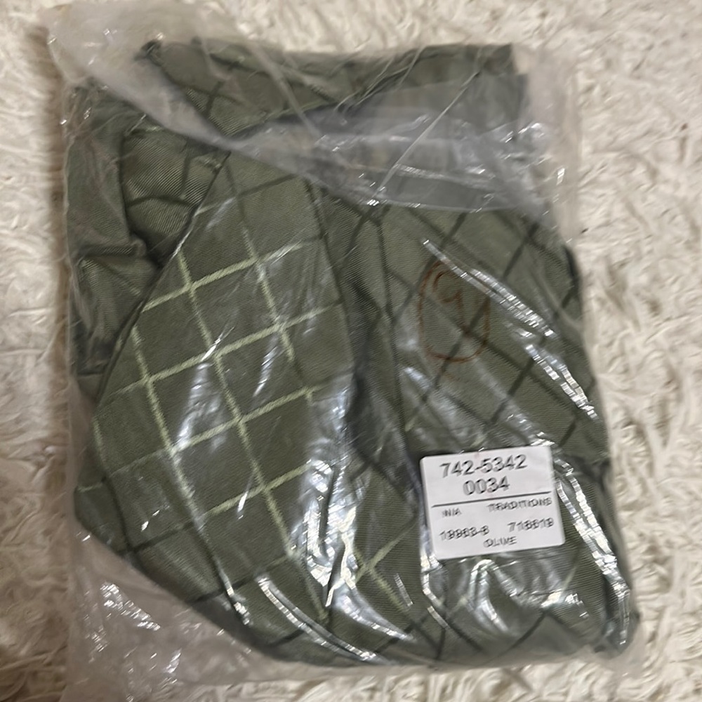 Still in bag shower curtain. Olive green with square patterns